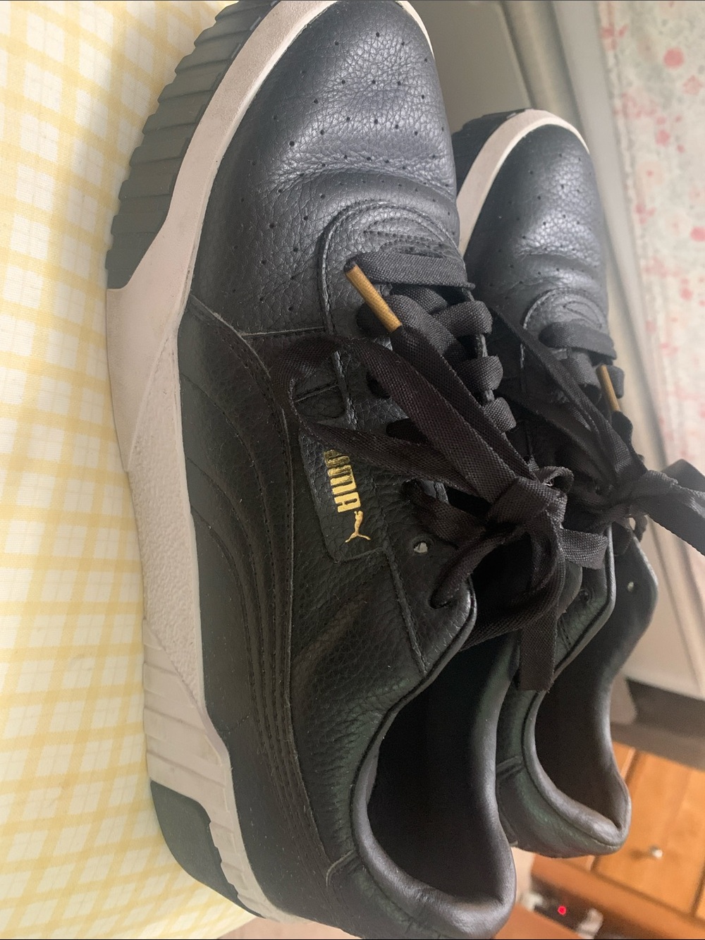 Puma Women’s Black Sneakers with Gold Accents